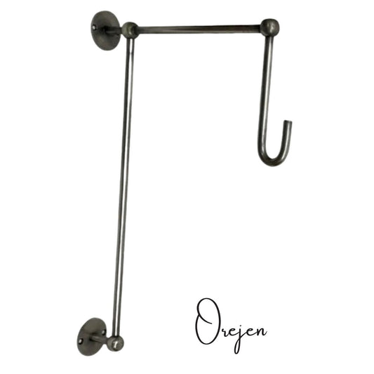 Pewter  wall hook with a long arm on a white background.
Also used for a long Wedding dress in Wedding Venues.