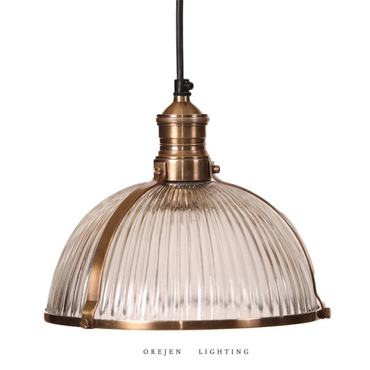 A fluted glass pendant light with a bronze-colored metal top, referred to as the 'Sutherland Glass Dumpling'.